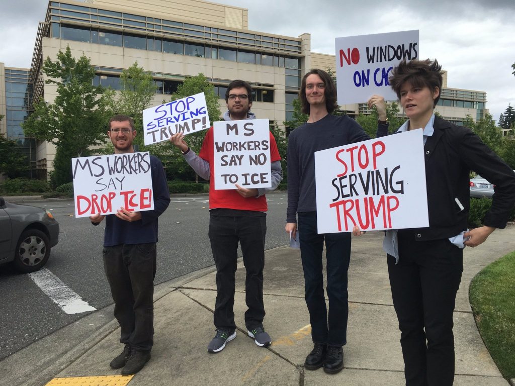 Organizers with signs and fliers calling on Microsoft to Drop Ice