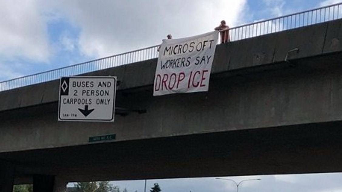 Banner saying "Microsoft workers say drop ICE"