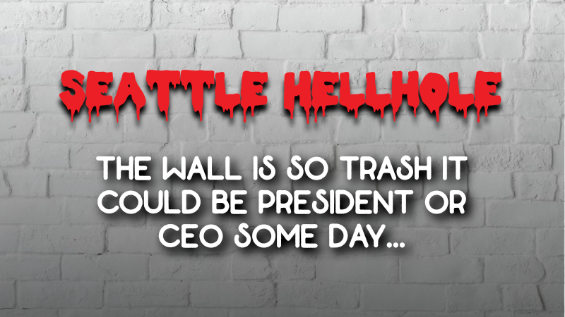 A brick wall painted white with the title "Seattle Hellhole" and subtitle "The Wall is so trash, it could be president or CEO someday."