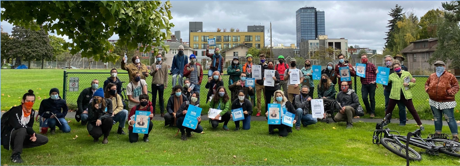 Photo of Seattle DSA members at University Playground, preparing to canvass in support of the Sherae for State campaign on a fall, overcast Seattle day.