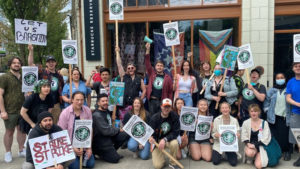 Many Starbucks workers on strike at the roastery holding picket signs